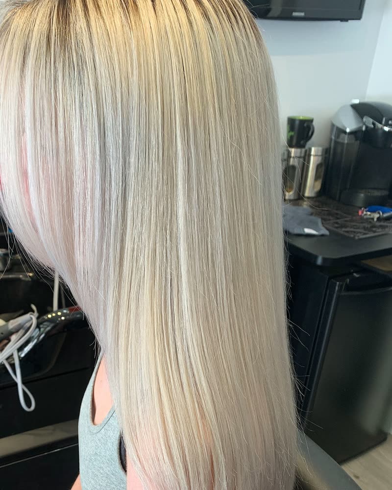 Long, straight platinum blonde hair with a soft shadow root at Will Vazquez Beauty Bar, Orlando